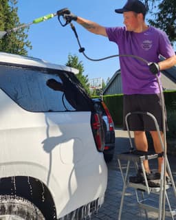 trevor cleaning a vehicle